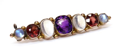 Lot 78 - A gold seven stone graduated assorted gemstone bar brooch, c.1900