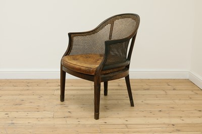Lot 231 - A mahogany bergère library tub armchair
