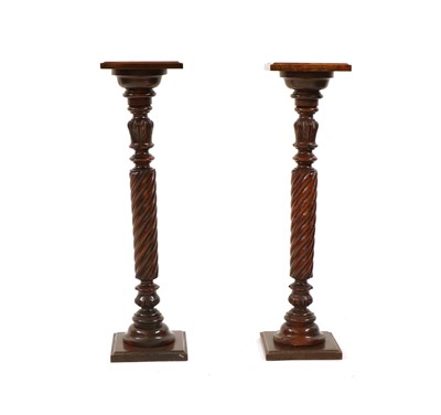 Lot 320 - A pair of beech torcheres