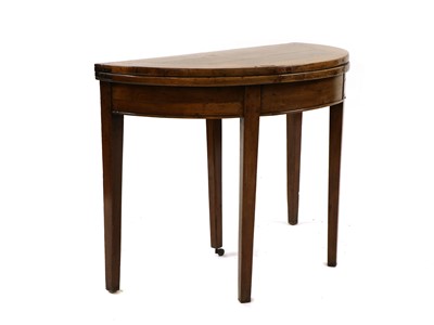 Lot 333 - A George III fruitwood fold over tea table