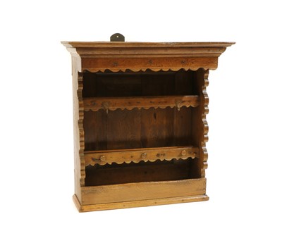 Lot 308 - An oak wall hanging plate rack