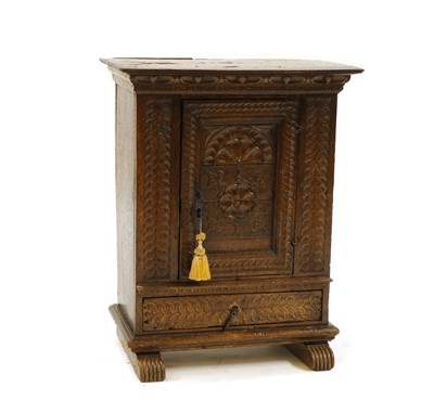 Lot 306 - An oak cupboard