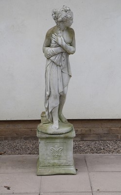 Lot 277 - A composite stone garden figure