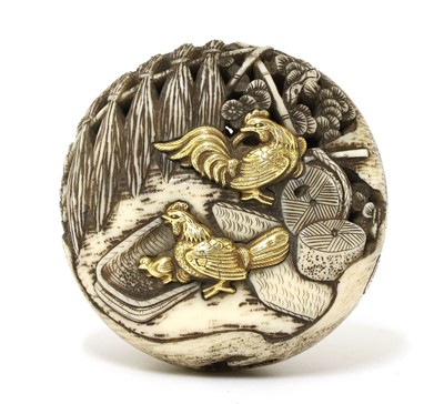 Lot 256 - A Japanese ivory manju netsuke