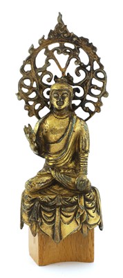 Lot 124 - A Chinese gilt-bronze Buddha