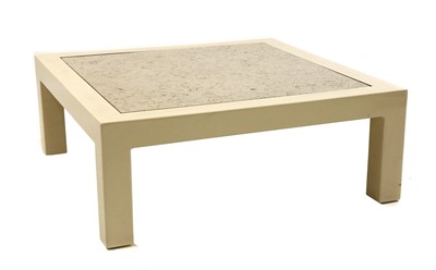 Lot 257 - A cream lacquered low coffee table