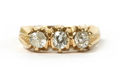 Lot 1007 - A gold three stone diamond ring