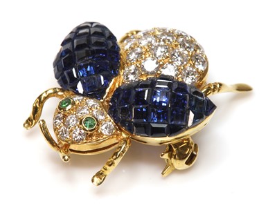 Lot 453 - A gold sapphire, diamond and emerald insect brooch