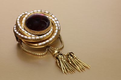 Lot 56 - A Victorian gold garnet and enamel brooch
