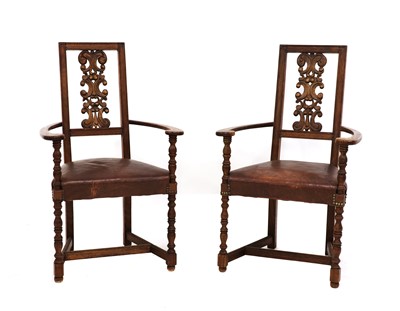 Lot 385 - A pair of Arts and Crafts oak armchairs