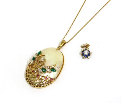 Lot 231 - A gold mother-of-pearl and paste set pendant