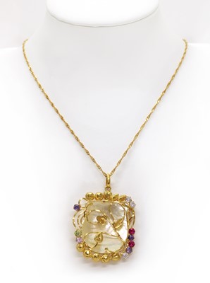 Lot 232 - A gold mother-of-pearl and cubic zirconia set pendant