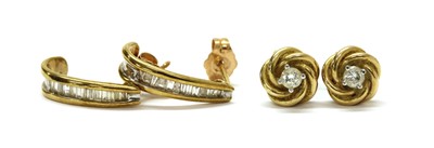 Lot 132 - Two pairs of 9ct gold diamond earrings