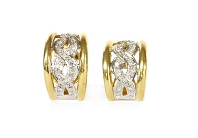 Lot 1100 - A pair of gold diamond set half hoop earrings