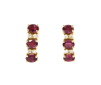 Lot 1140 - A pair of gold ruby and diamond earrings