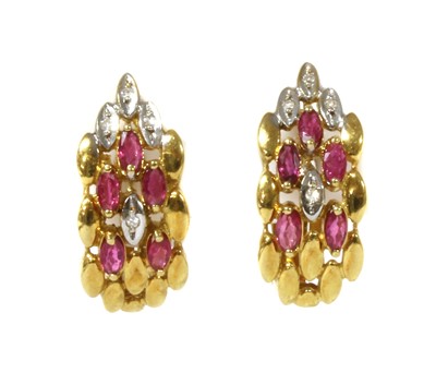 Lot 1152 - A pair of gold ruby and diamond earrings