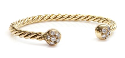 Lot 397 - A diamond set torque bangle