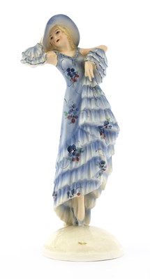 Lot 274 - A Goldscheider figure of a lady in a blue dress and hat