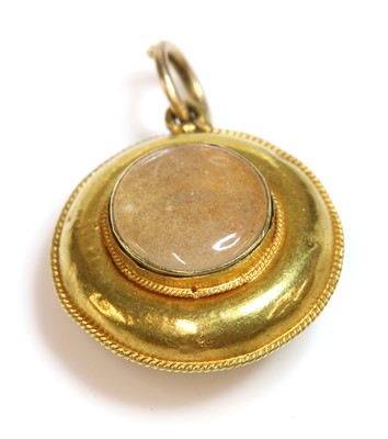 Lot 71 - A Victorian turquoise set circular shield form pendant, c.1860