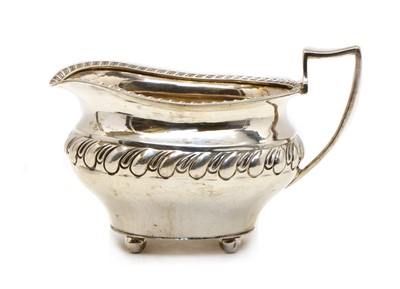 Lot 11 - An Edwardian Irish silver sauce boat
