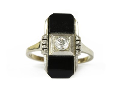 Lot 1065 - A Continental white gold diamond and onyx ring