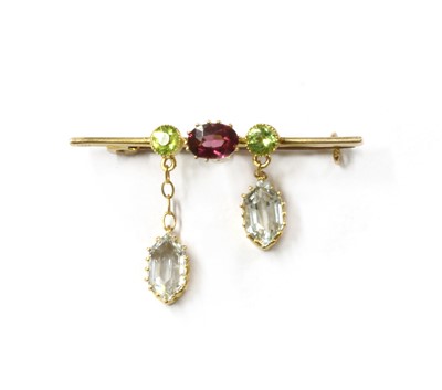 Lot 1048 - An Edwardian gold aquamarine, garnet and peridot brooch