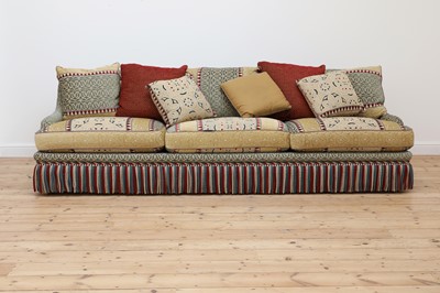Lot 81 - A three-seater sofa
