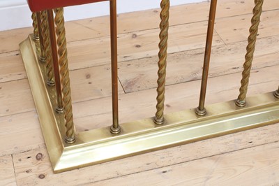 Lot 84 - A large brass club fender