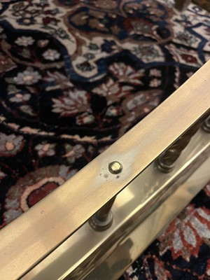 Lot 84 - A large brass club fender