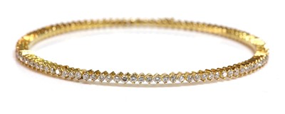 Lot 332 - A diamond set bangle