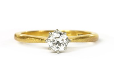 Lot 1089 - A gold single stone diamond ring