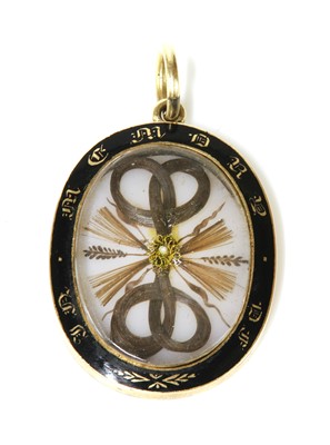 Lot 33 - A Victorian gold glazed memorial locket