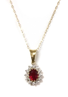 Lot 1153 - A 9ct gold fracture filled ruby and diamond cluster pendant