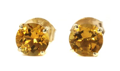 Lot 1182 - A pair of gold single stone citrine stud earrings