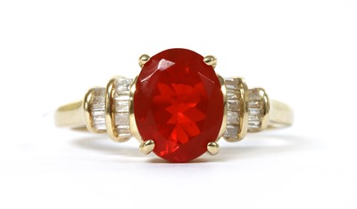 Lot 1174 - A gold fire opal and diamond ring