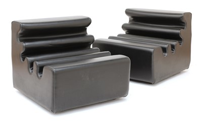 Lot 554 - A pair of black vinyl loungers