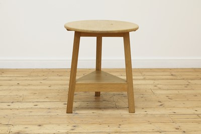 Lot 255 - An oak 'cricket' table