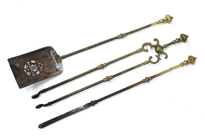 Lot 224 - A set of George III brass fire irons