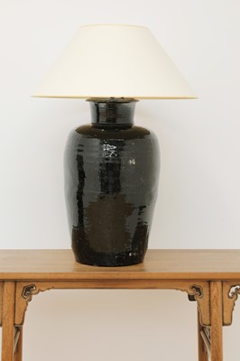 Lot 271 - A large treacle-glazed pottery table lamp