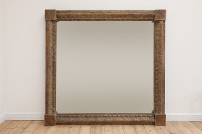 Lot 55 - A monumental carved pine-framed wall mirror