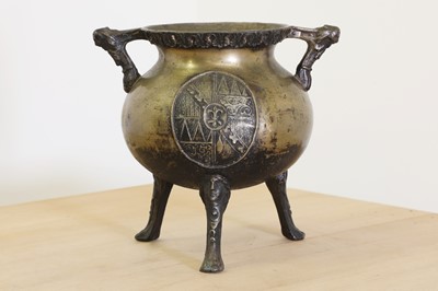 Lot 770 - A cast brass tripod cauldron