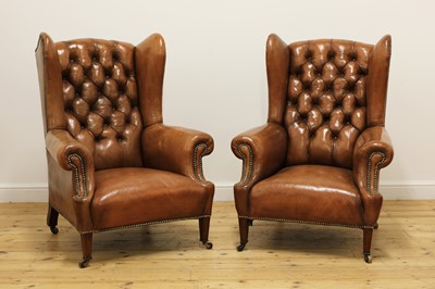 Lot 218 - A pair of wing back armchairs