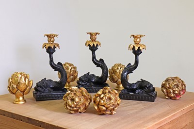 Lot 240 - A set of three rococo-style composite and gilt-metal candleholders