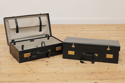 Lot 38 - Two graduated black leather suitcases by Tanner Krolle