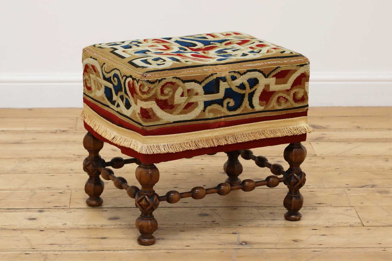 Lot 18 - A walnut stool in the manner of A W N Pugin