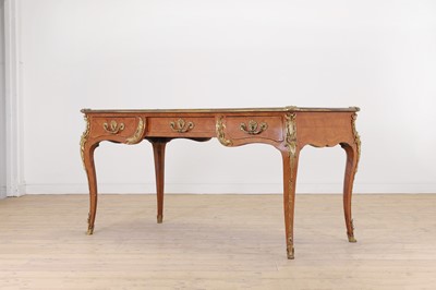 Lot 471 - A Louis XV-style tulipwood bureau plat