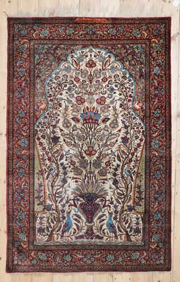 Lot 237 - A Persian silk carpet