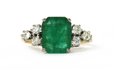 Lot 1193 - A gold emerald and diamond ring