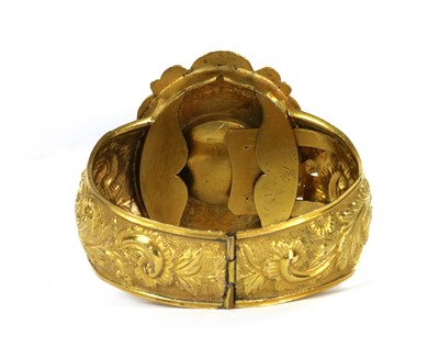 Lot 1017 - A Victorian gilt metal amethyst bangle