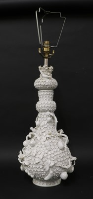 Lot 211 - A Continental porcelain floral-encrusted vase lamp